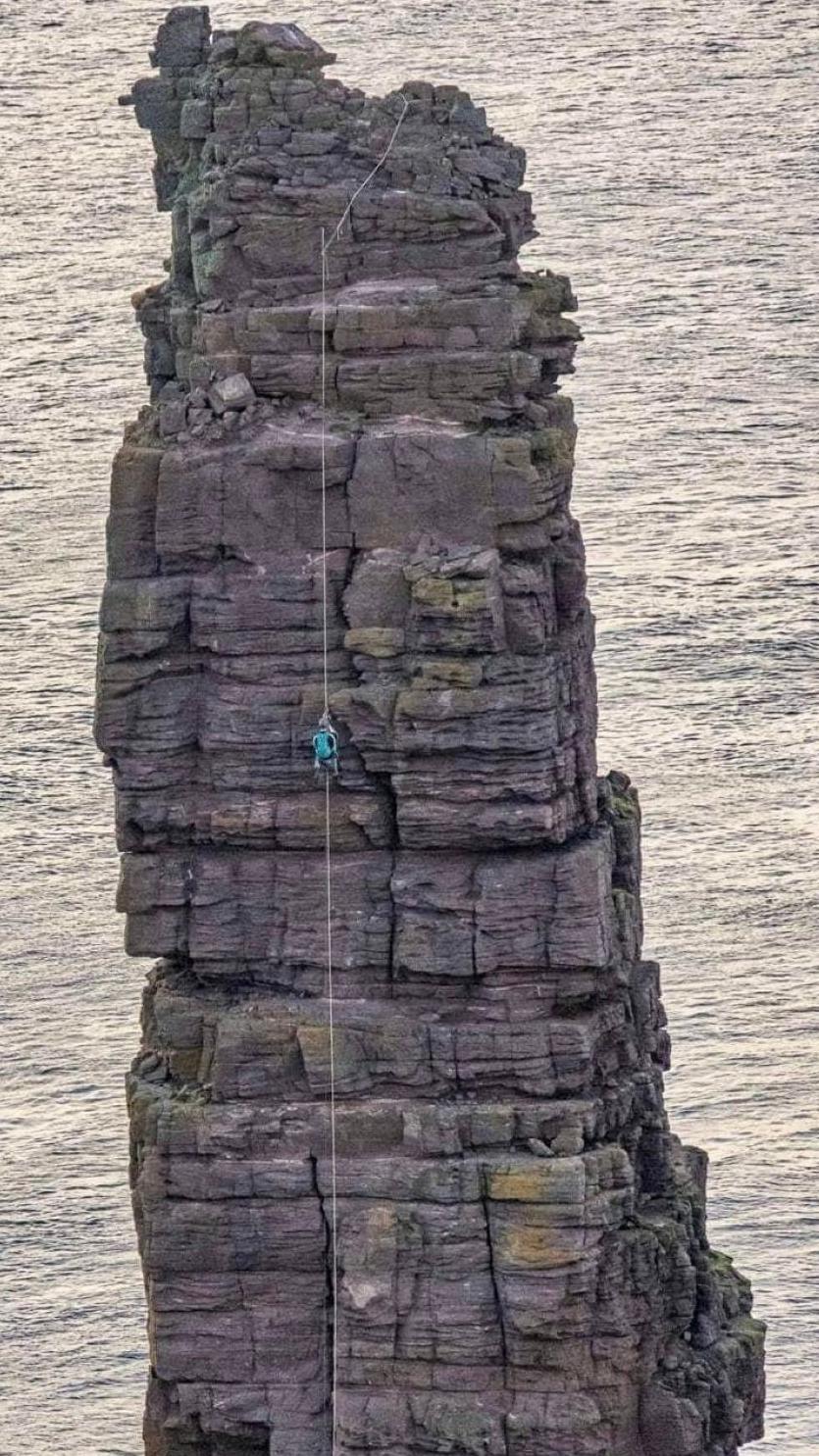 Climbers on sea stack