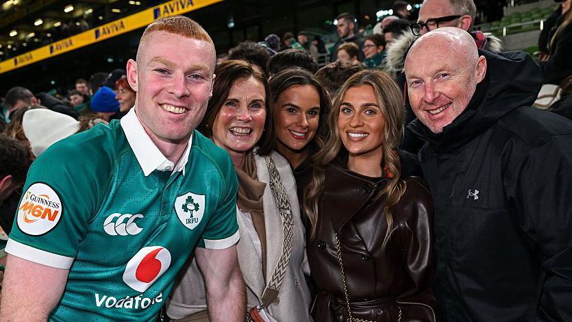 Nathan Doak pictured with family and friends, including father Neil (right)