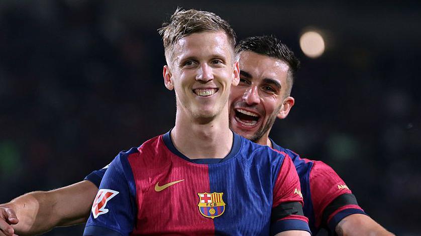 Dani Olmo celebrates scoring with team-mate Ferran Torres