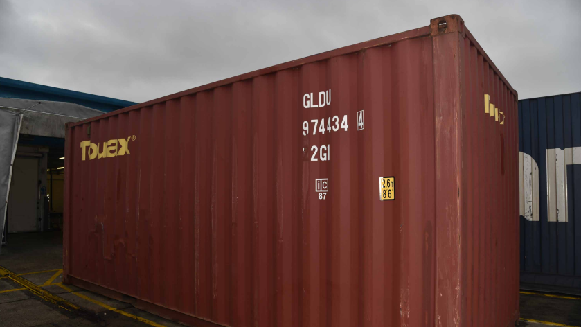 A red shipping container