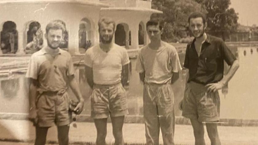 A historical photo showing the four men - John Everest, John Willmore, Peter Taylor, and John McQueen - on a stop off in 1959