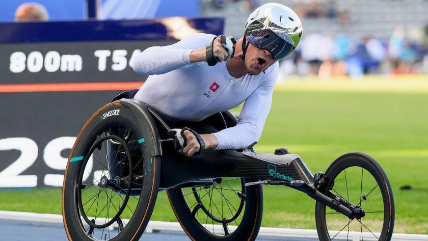 Marcel Hug celebrates at the 2023 Para-athletics World Championships