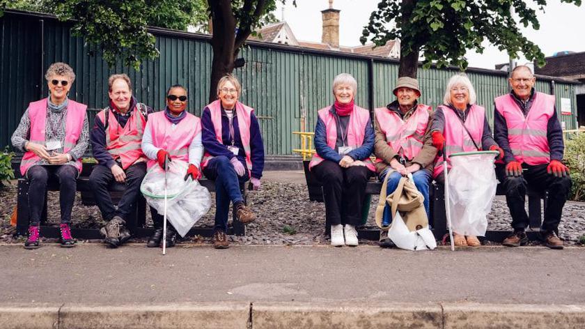 Volunteers on a train platform