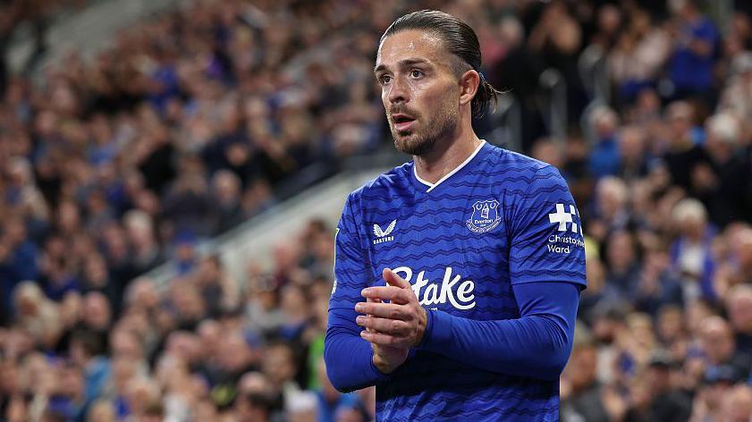 Jack Grealish applauds the Everton supporters