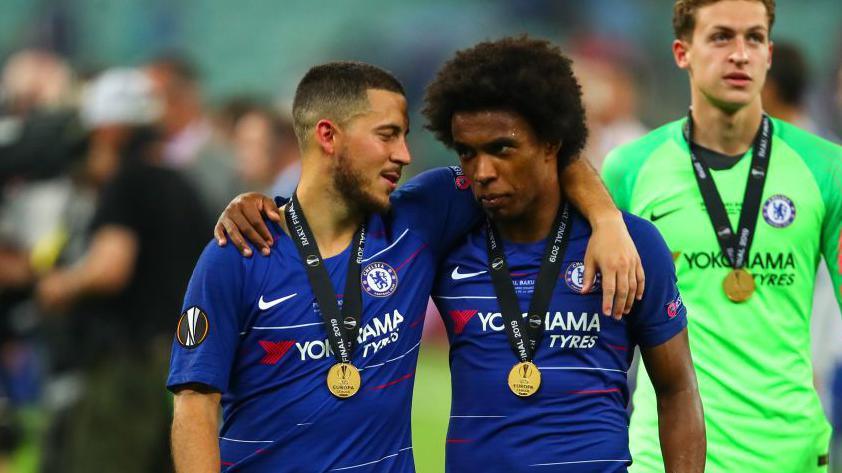Eden Hazard and Willian talk after picking up Europa League winner medals