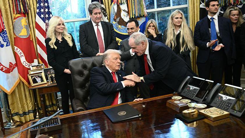 US President Donald Trump shakes hands with US Senator James Risch, Republican from Idaho during a swearing-in ceremony 