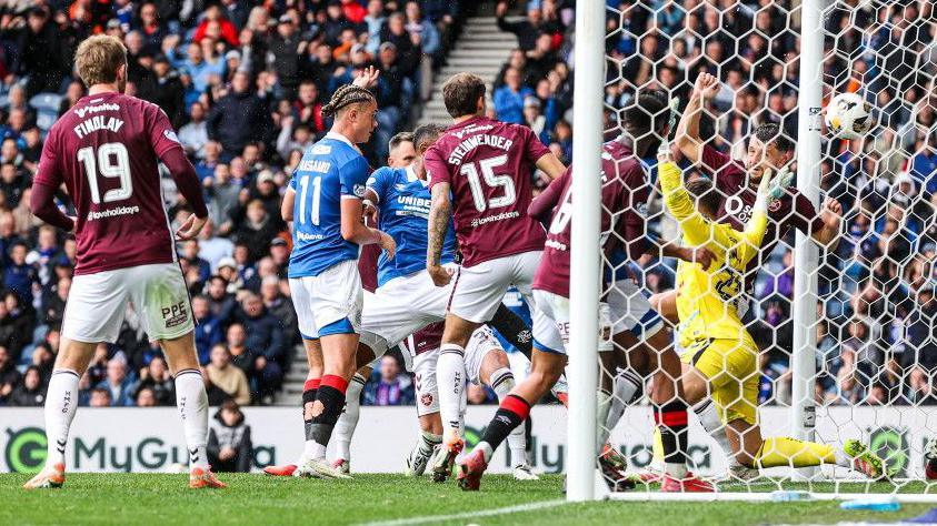 Rangers' Dean Cornelius puts the ball in the net against Hearts