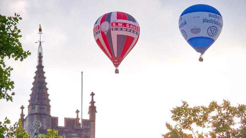 Two hot air balloons in the air