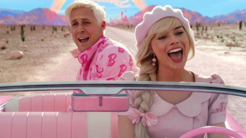 Barbie and Ken drive in the Barbie movie.