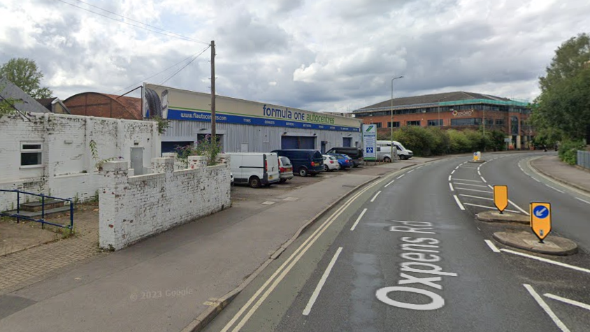 Google street view of a white brick building which was a former nightclub next door to the formula one autocentre, a car garage.