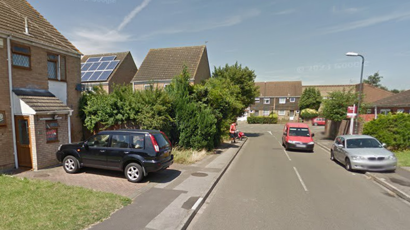 A screenshot from Google street view showing houses, cars and front lawns in Rochfords Gardens.