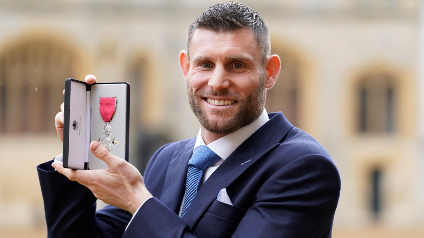 James Milner is pictured with the MBE he was presented with in 2023 for services for football and charity