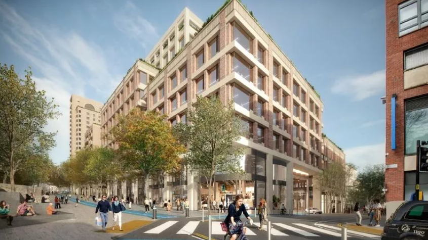 An artist's impression of the new shopping centre with a building about six storeys high and a colonaded ground floor with shop windows. The street is tree-lined with pedestrians walking along it