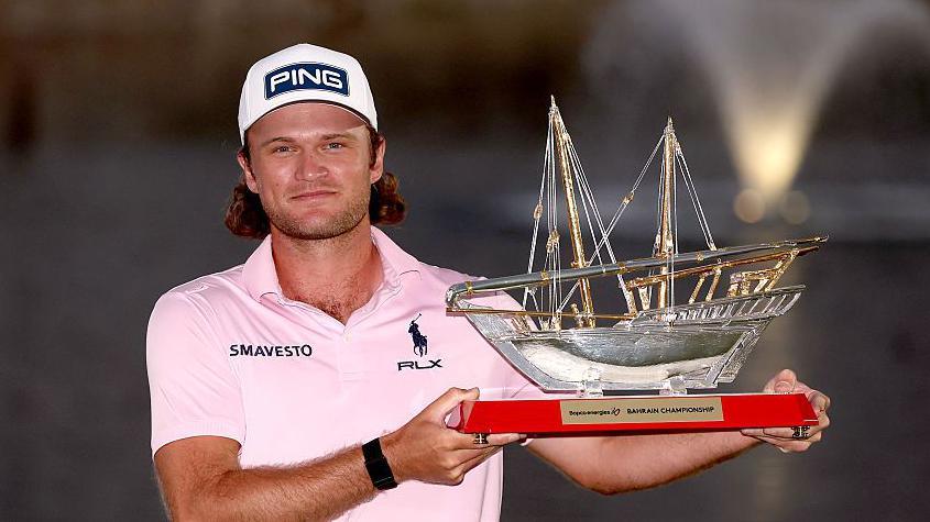 Golfer Freddy Schott with the Bahrain Championship trophy