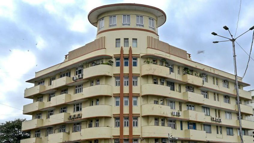 An Art Deco apartment block on Mumbai's marine drive with a turreted rooftop typical of the style. 