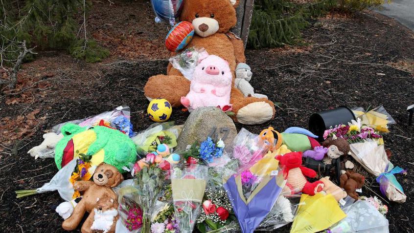 A makeshift memorial outside  the home of Lindsay Clancy