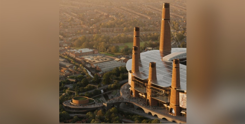 A section of the stadium is bathed in sunlight in an aerial view, Five towers are visible with crowds walking around the ground and around a circular section to the left.