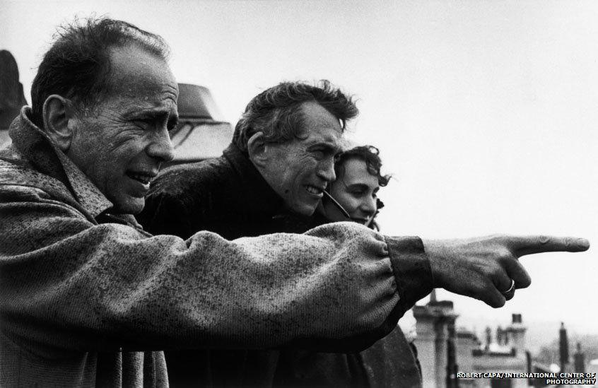 John Huston and Humphrey Bogart watching the coronation of Queen Elizabeth II.