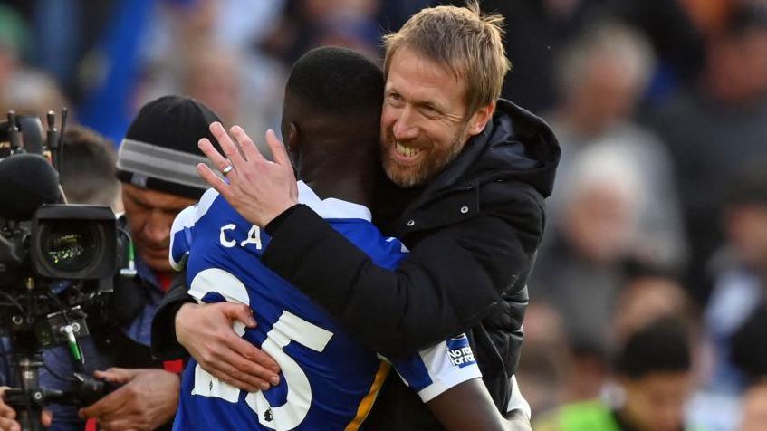 Moises Caicedo and Graham Potter celebrate after Brighton's 4-0 win over Manchester United in May 2022, which was Caicedo's sixth league appearance for the Seagulls