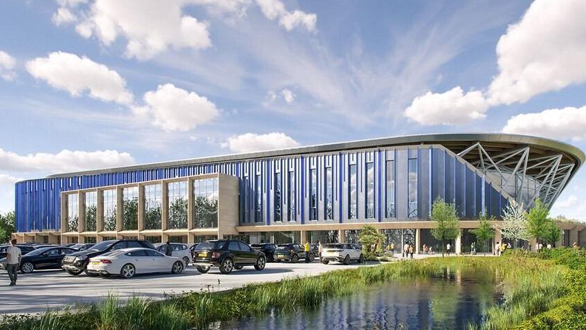 CGI image of the exterior of Oxford United's planned new stadium with cars parked outside and a pond and green area to the side
