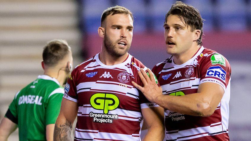 Kaide Ellis is congratulated by Liam Byrne on scoring a try against Leeds.