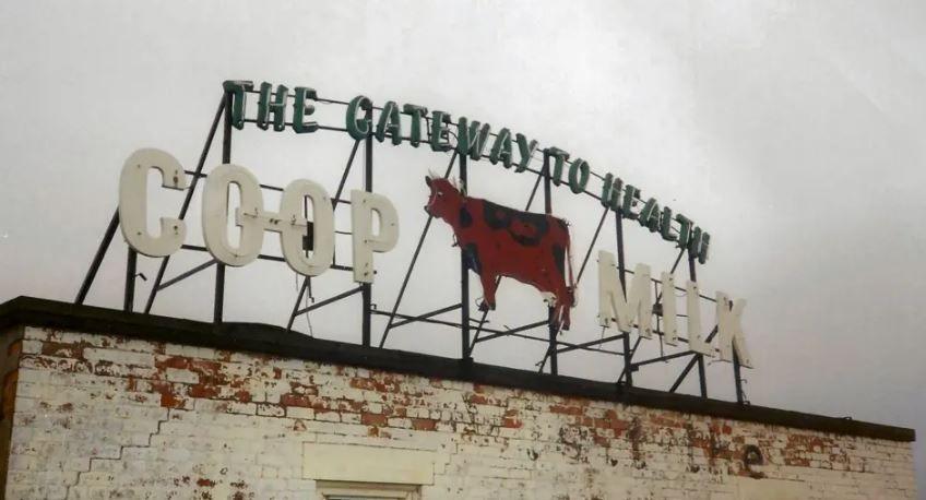 The original sign on top of a building in Derby city centre at which reads THE GATEWAY TO HEALTH COOP MILK