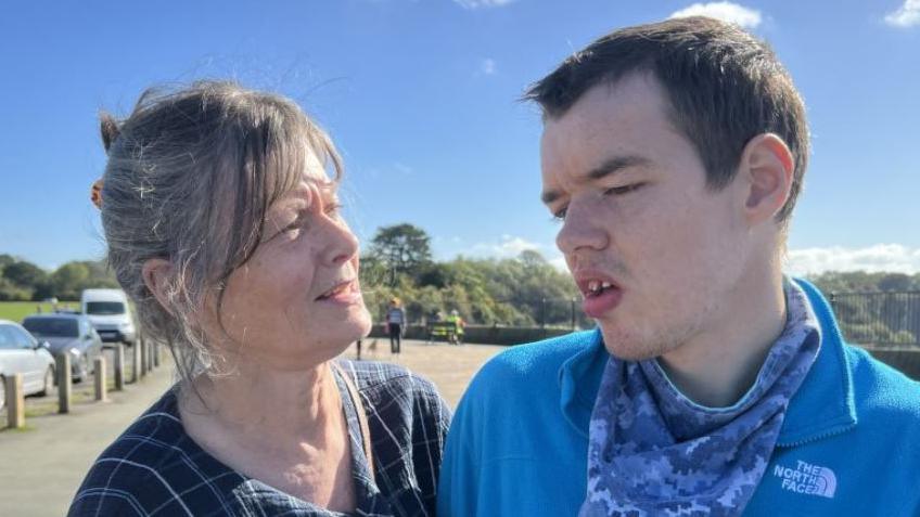 Philippa Spearing and her son Angus. He is wearing a blue jumper and scarf.