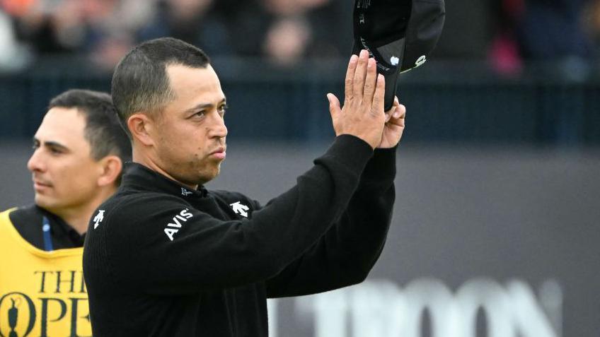 Xander Schauffele acknowledges the fans on the 18th after winning The Open at Royal Troon