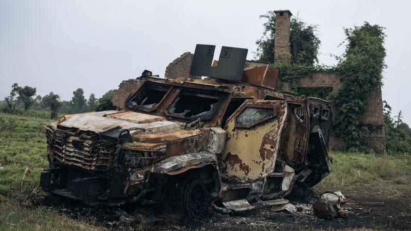 A destroyed armoured vehicle is seen following clashes in the outskirts of Goma on February 2, 2025.