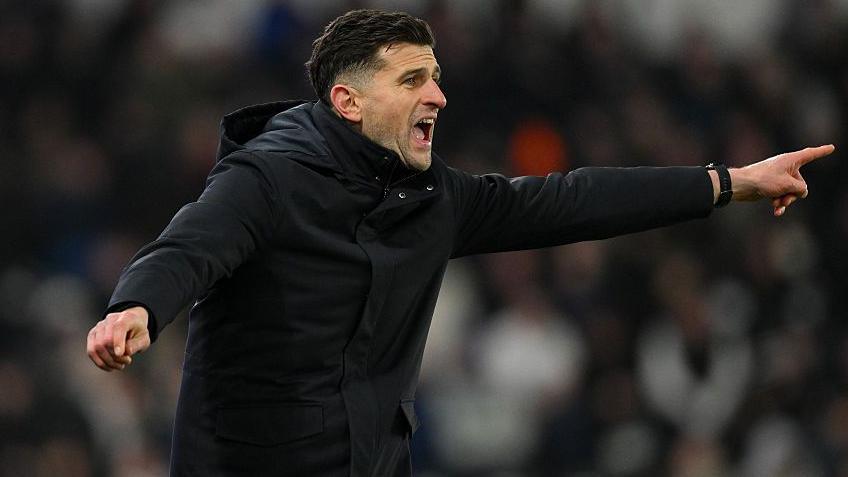 John Mousinho shouts instructions from the sidelines 