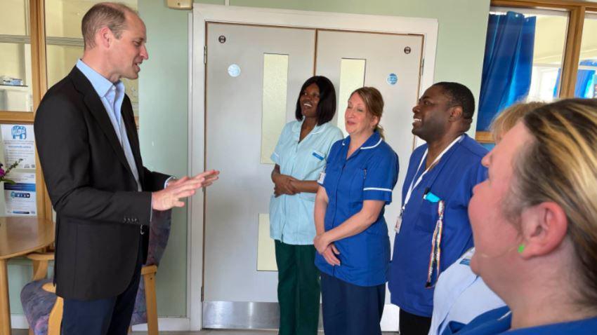 Prince William speaks to staff at St Mary's Medical Centre