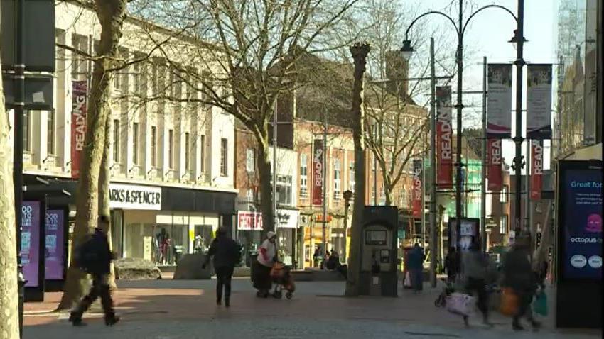 Broad Street in Reading - a pedestrianised area with several people walking along the road