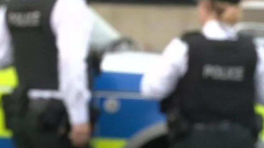 Blurred image of two police officers 