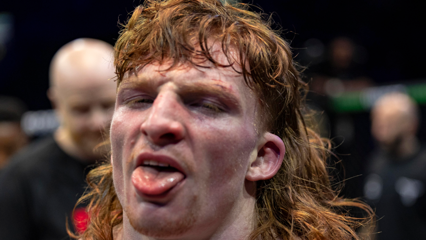Lewis McGrillen sticks his tongue out after a win