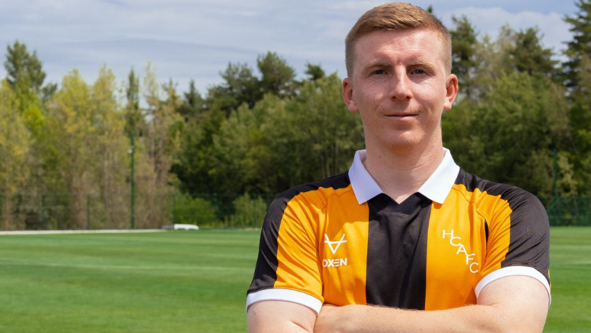 Matt Targett poses in a Hull City shirt