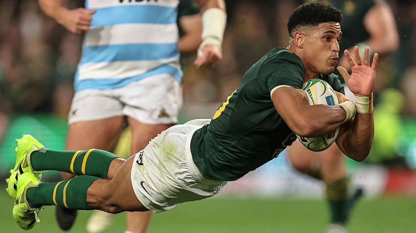 Sacha Feinberg-Mngomezulu diving to score a try