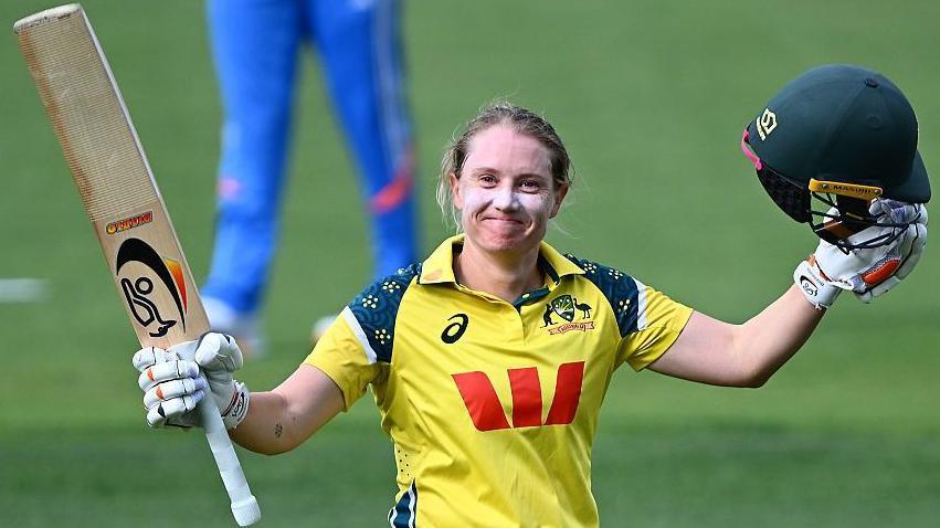 Alyssa Healy of Australia celebrates scoring a century during game three of the women's one-day international series between Australia and India at Bellerive Oval 