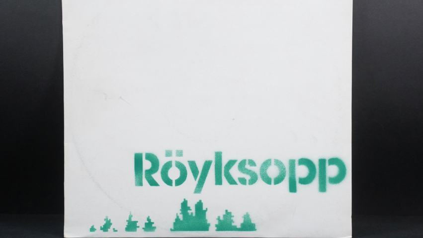 A vinyl cover with the word 'Röyksopp' in a green, stencilled format, and green pixelated treetops.