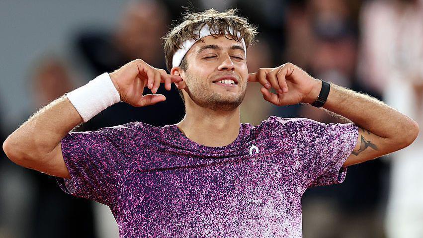 Flavio Cobolli of Italy celebrates match point against Felix Auger-Aliassime of Canada 