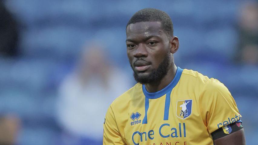 Deji Oshilaja in action for Mansfield Town
