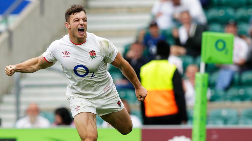 Adam Radwan celebrates scoring a try for England in 2021