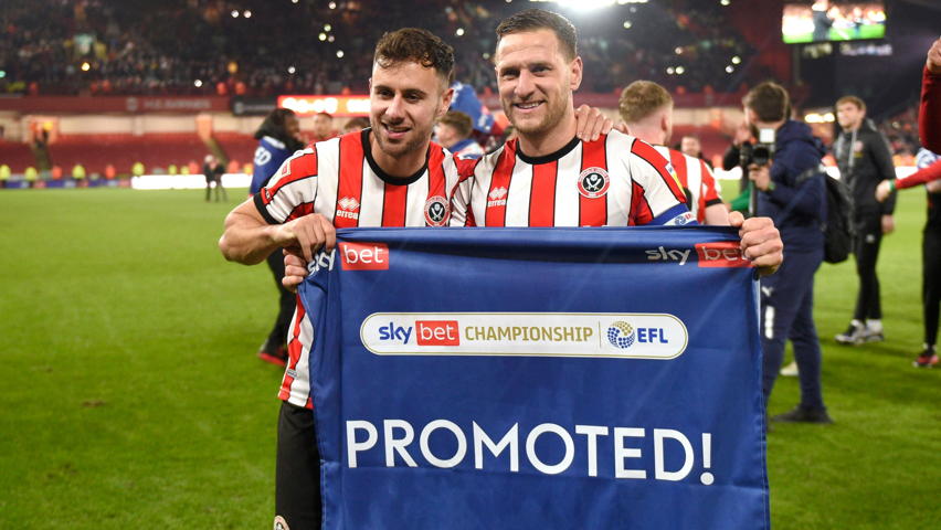 Billy Sharp (right) with George Baldock celebrating Sheffield United's promotion to the Premier League in 2023