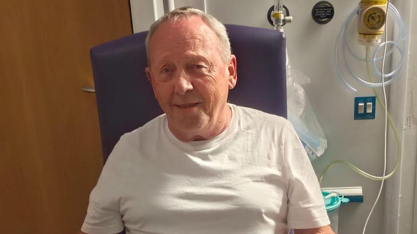 Geoff Smart sitting in a hospital chair