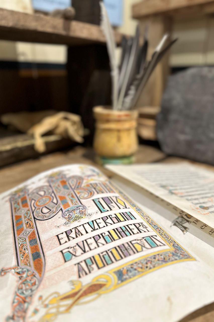 Gospel incipit folio, feathers, scribe’s desk, slate sketch