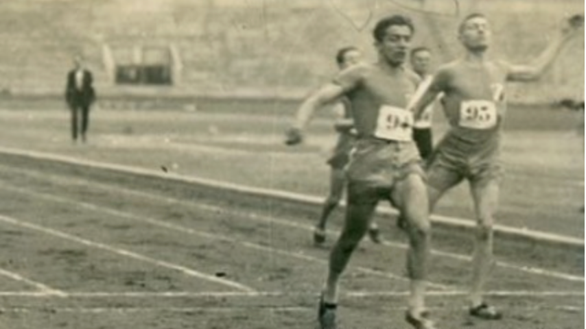 Athletes in the 100m race crossing the finish line at Stade de Preshing, Paris in 1924.