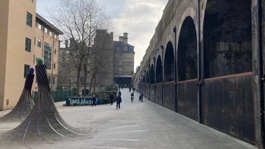Bradford Forster Square station with the archways and the walkway out to the main street in view.