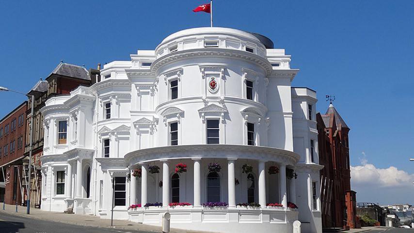 The Isle of Man's parliamentary buildings, known as the Wedding Cake, which is a round, white, three-tiered building.