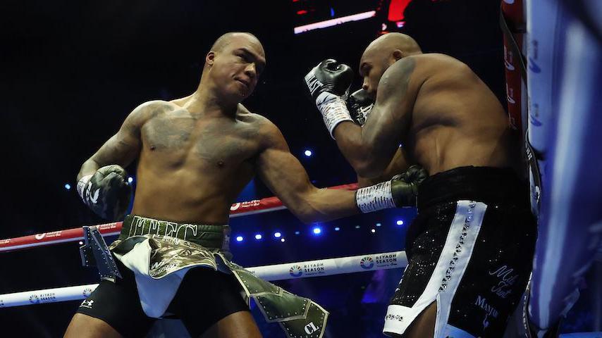 Fabio Wardley throws a left hook against Frazer Clarke