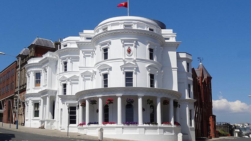 The Isle of Man's parliamentary buildings, known as the Wedding Cake, which is a round, white, three-tiered building.