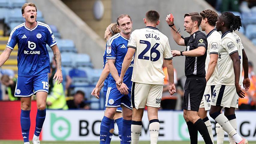 Leicester midfielder Oliver Skipp receives a straight red card in the first half